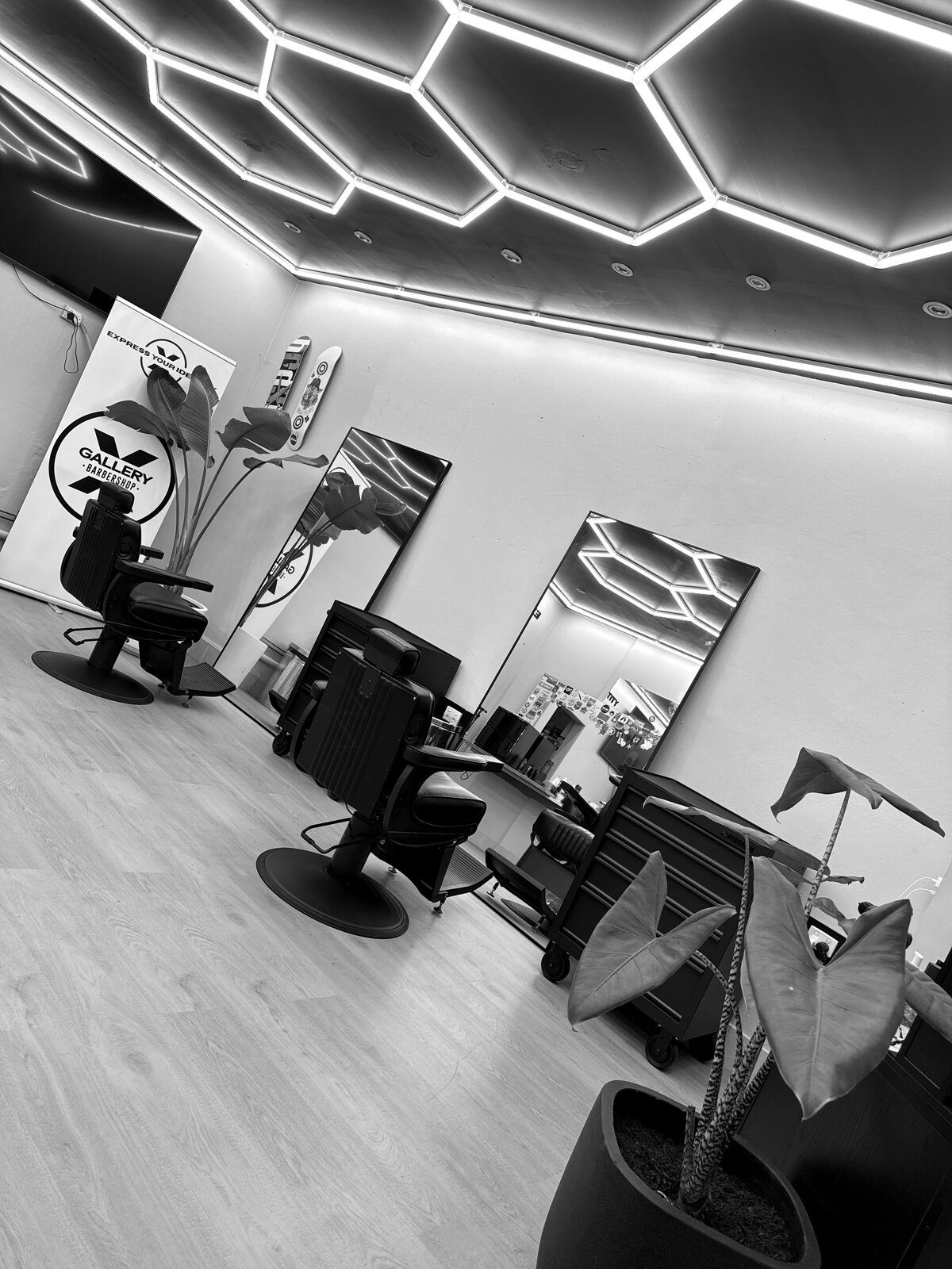 Gallery X Barbershop interior in Hamilton, Newcastle — barber chairs, mirrors and honeycomb ceiling lighting